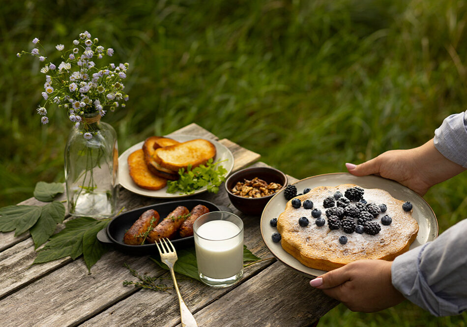 high-angle-hands-holding-plate-with-pie