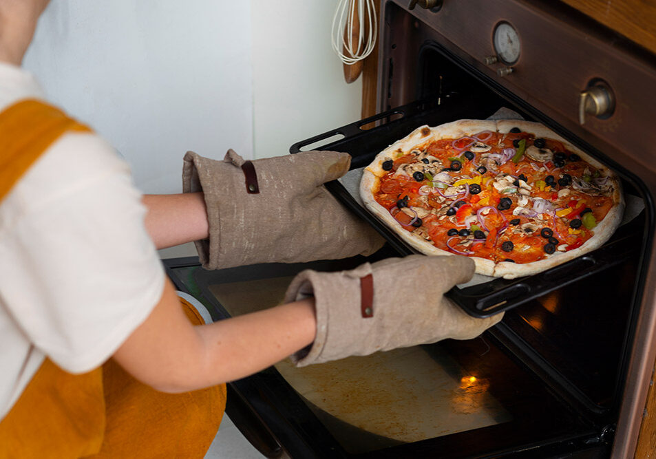 side-view-woman-cooking-pizza