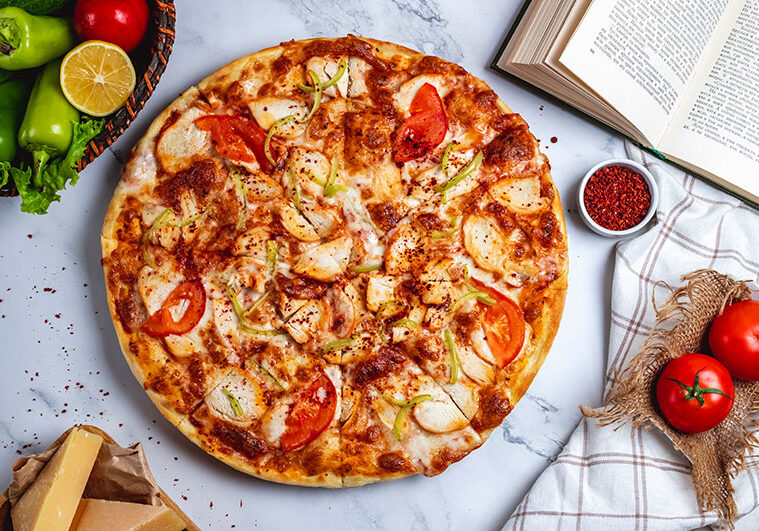 top-view-pizza-with-chicken-green-chili-pepper-tomatoes-cheese-table