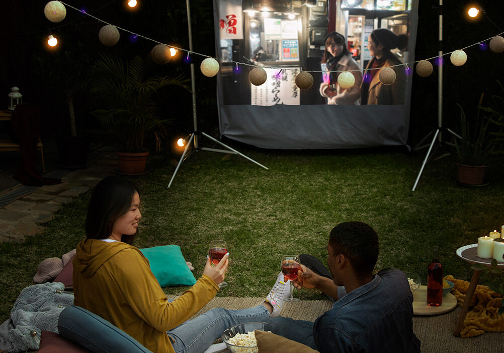 young-friends-having-fun-cinema-open-air